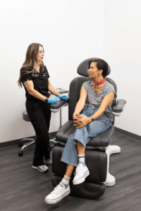 Practitioner seeing a patient for potential breast implant complications in Murrieta