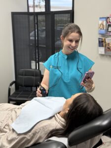 Practitioner examining a patient's implants for ruptures at Renuance in Murrieta