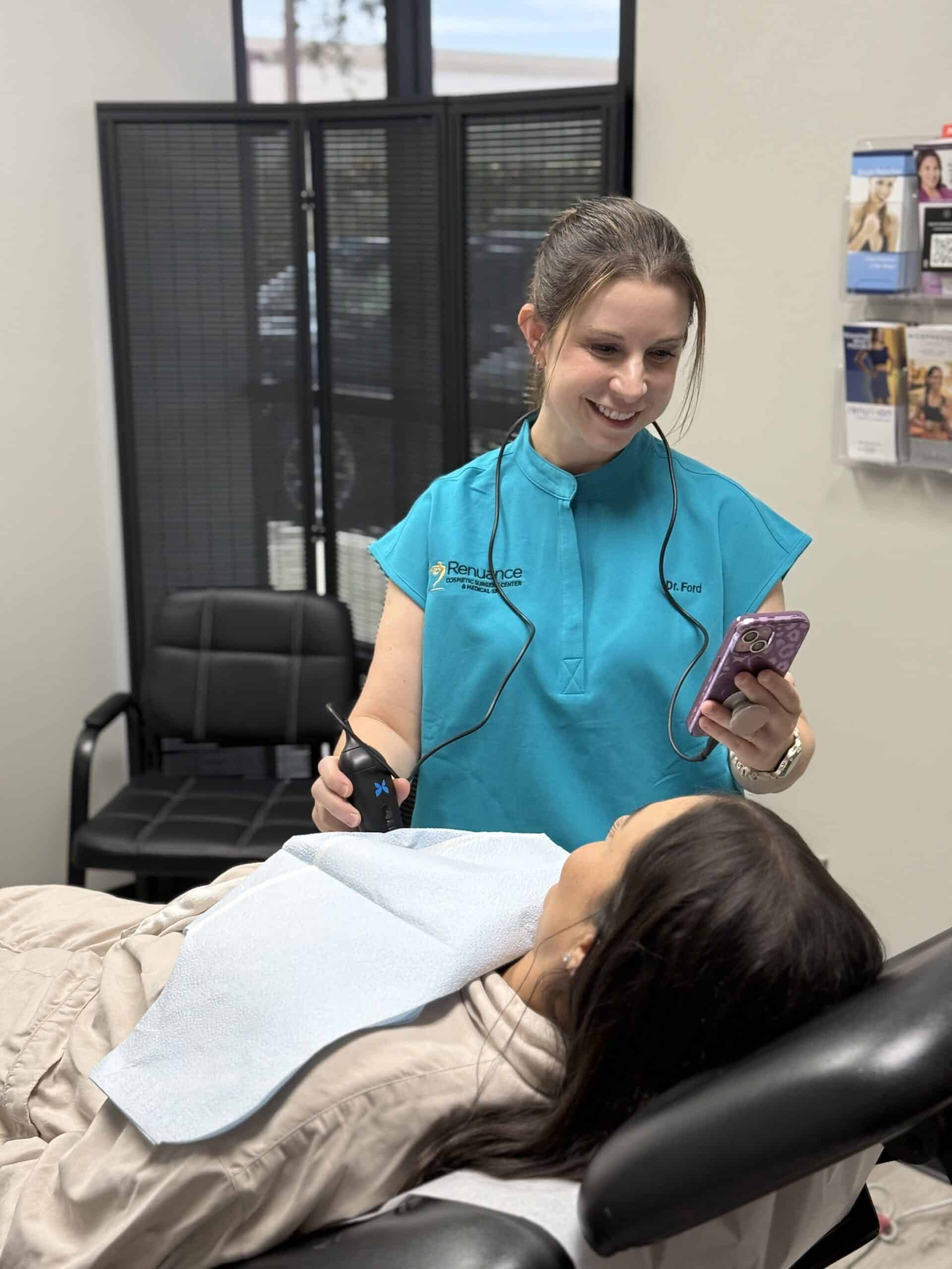 Practitioner examining a patient's implants for ruptures at Renuance in Murrieta