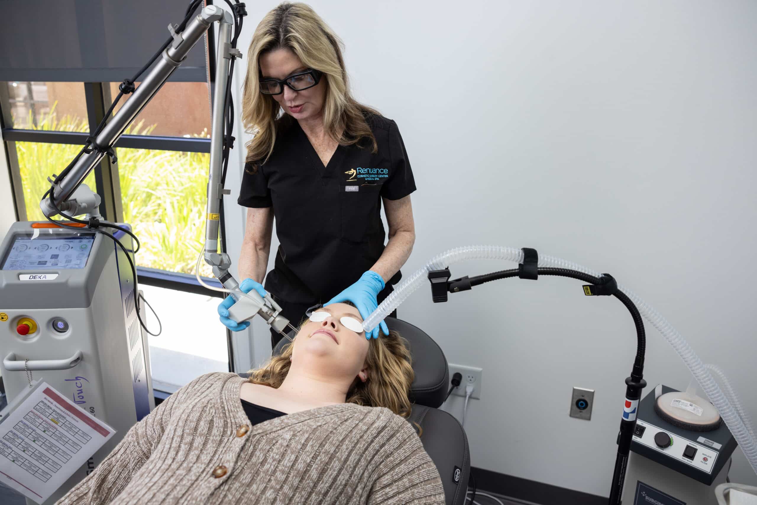 Clinician at Renuance performing acne laser treatment on a patient at their Murrieta office using advanced laser equipment.